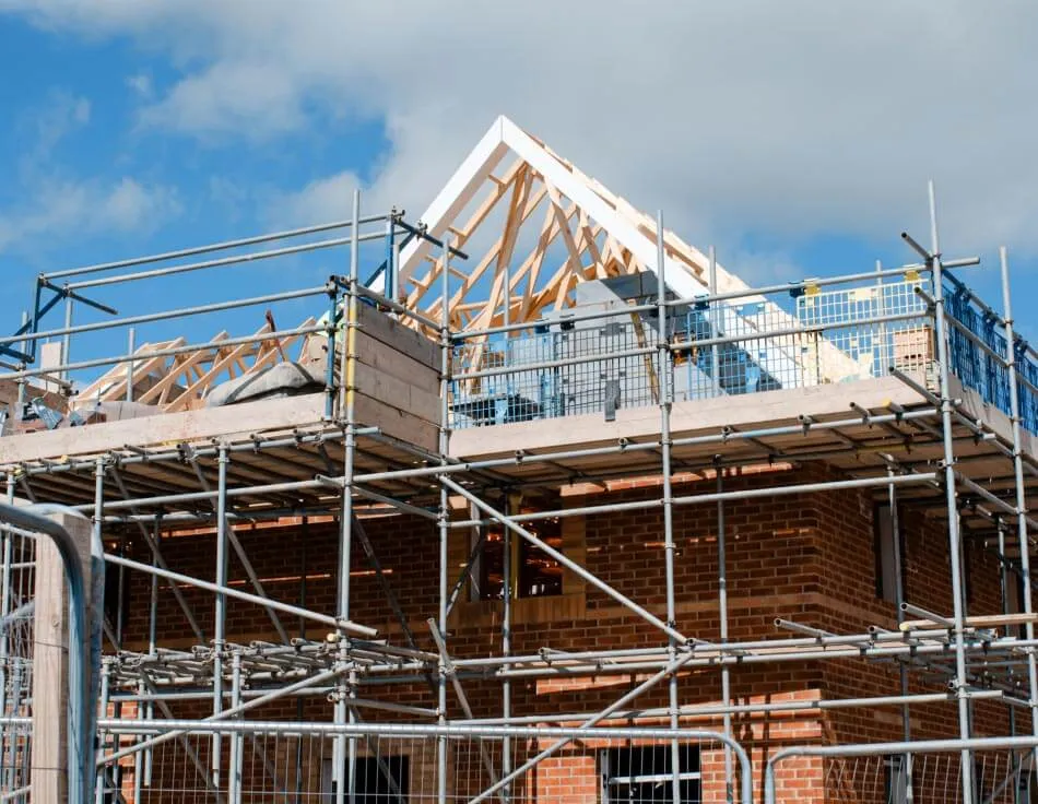 Scaffolding erected around a property under construction in Surrey